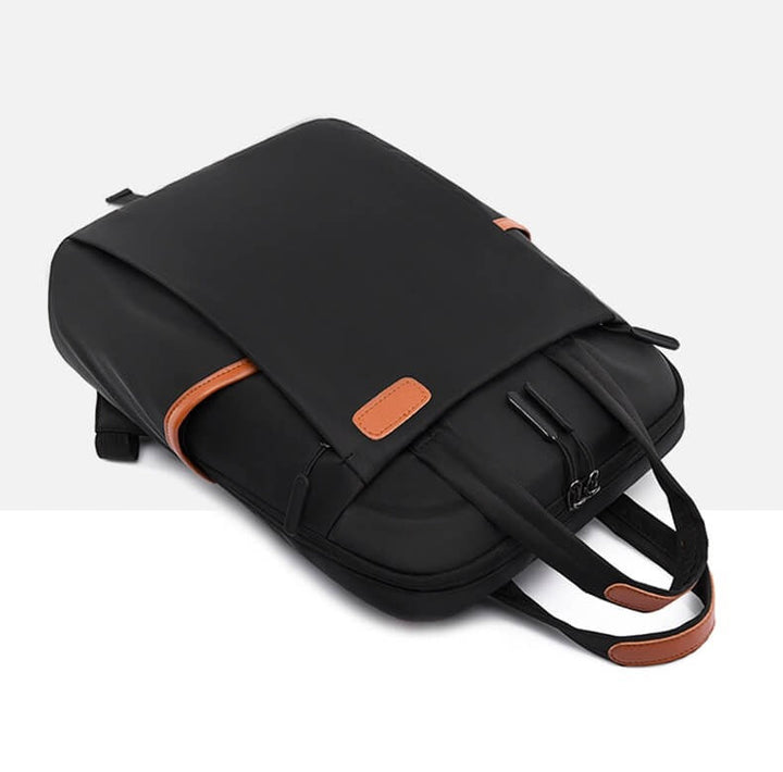 Front view of a women's water-resistant anti-theft travel backpack, sleek Oxford design.
