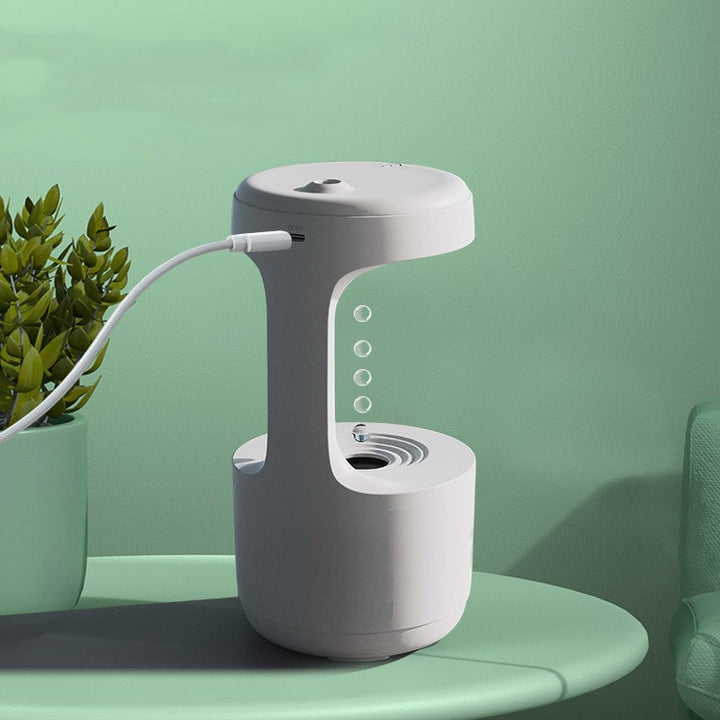 Relaxing anti-gravity humidifier for any room, featuring a calming LED glow and convenient digital clock.