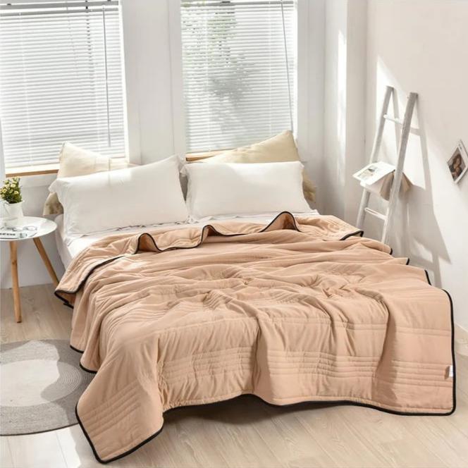Experience cozy comfort with this breathable blue cooling blanket, ideal as a soft bed or sofa throw.
