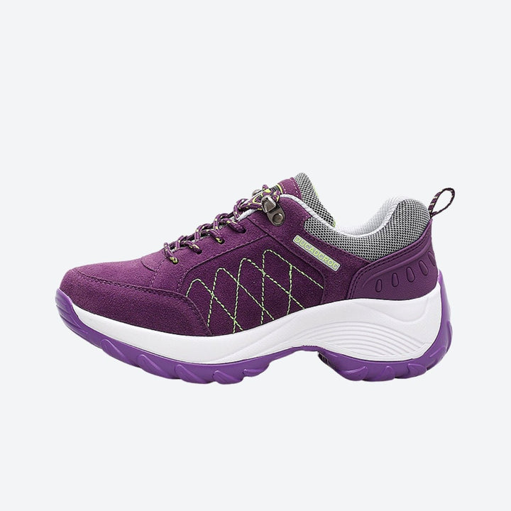 Magenta women's trainers with exceptional arch support for active lifestyles.