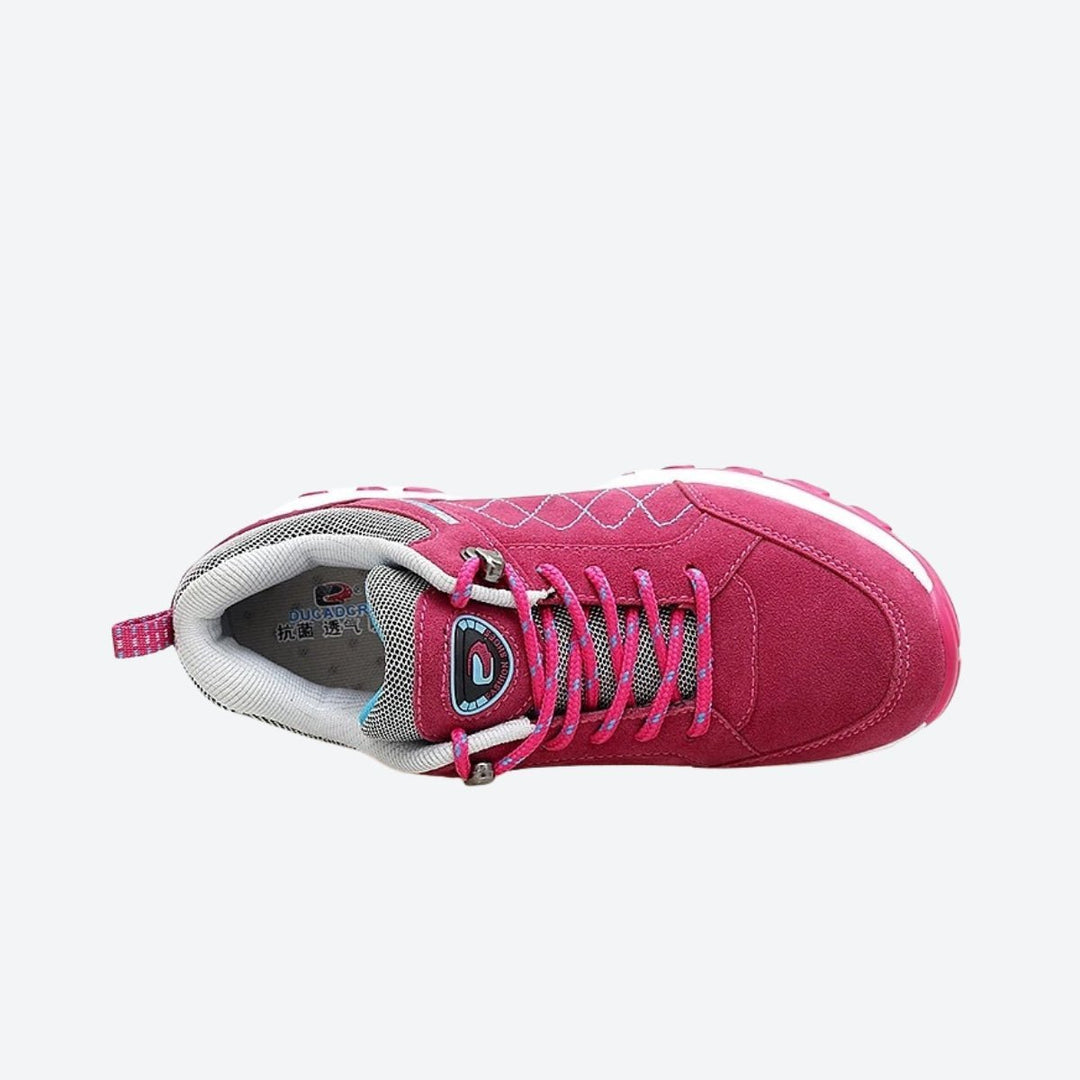 Athletic women's sneakers in vibrant purple with supportive arch cushioning.