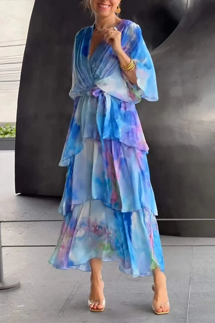 Elegant blue women's flowing tiered ruffle wrap maxi dress, perfect for race day events or as a wedding guest.