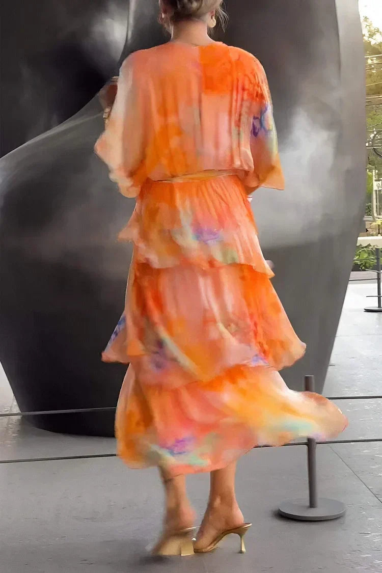 Sophisticated orange women's flowing tiered ruffle wrap maxi dress, an elegant choice for any special occasion.