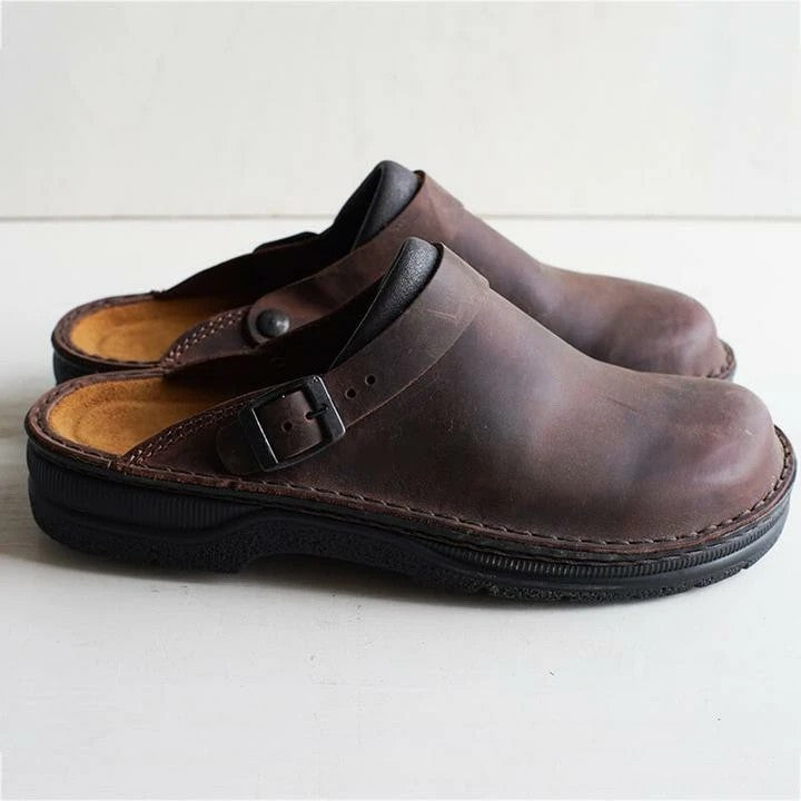 Dark brown men's orthopedic clog mules with adjustable buckle for comfort & support.