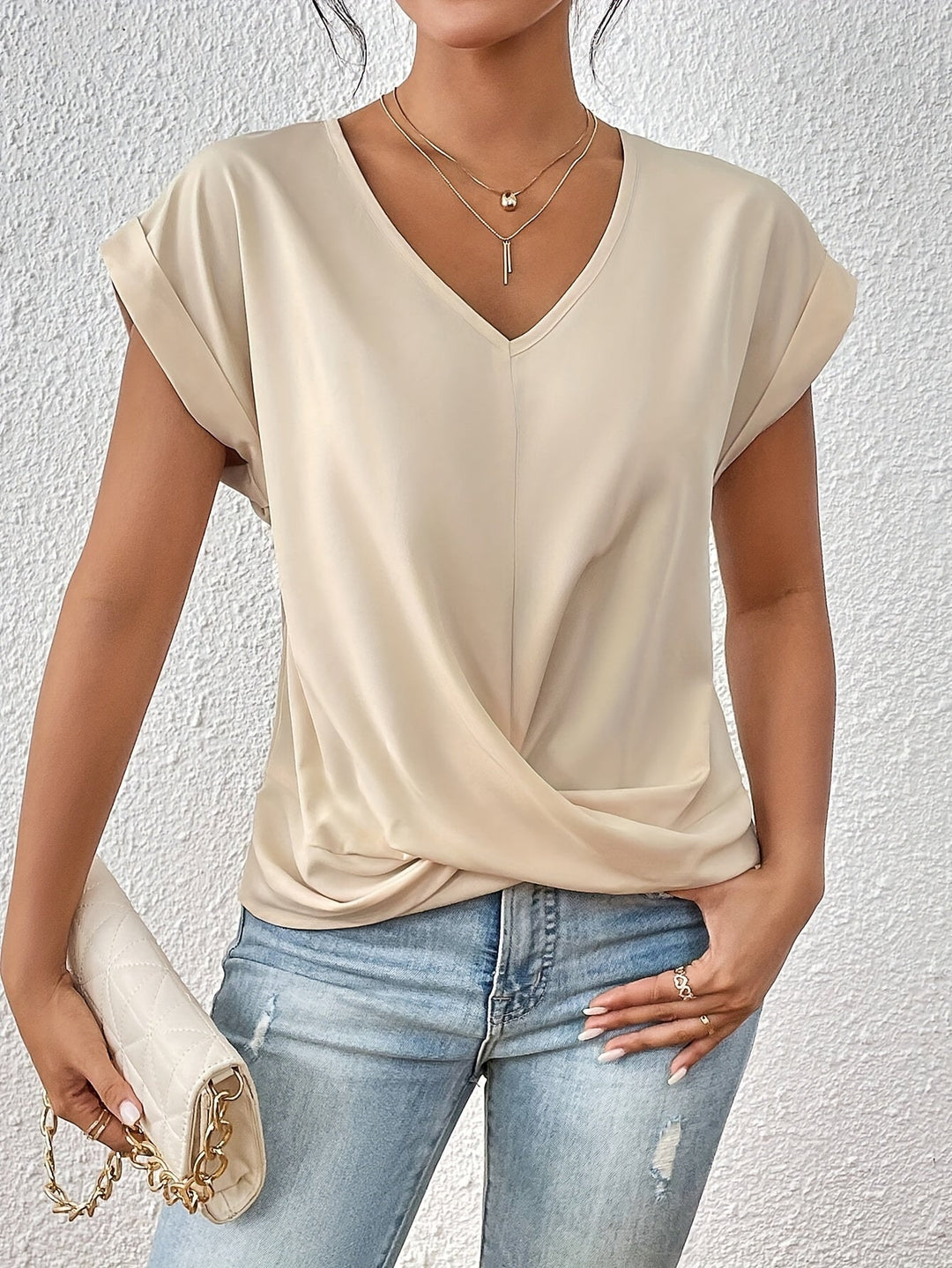 Versatile women's V-neck top with short sleeves, ideal for summer casual outfits.