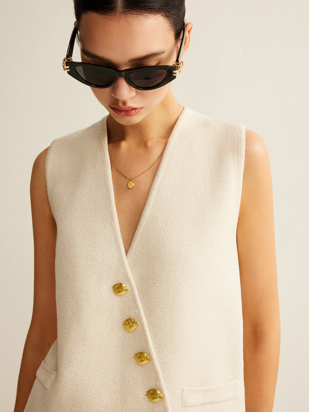 Elegant women's waistcoat sweater vest in a soft knit, great for professional or casual style.
