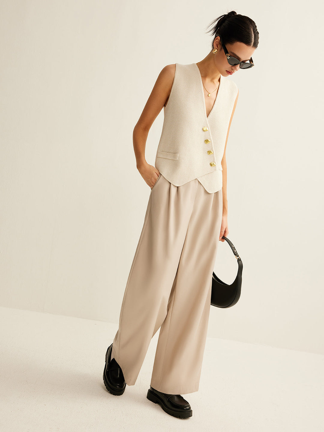 Modern women's sleeveless v-neck sweater vest. A fashionable layering top for any occasion.