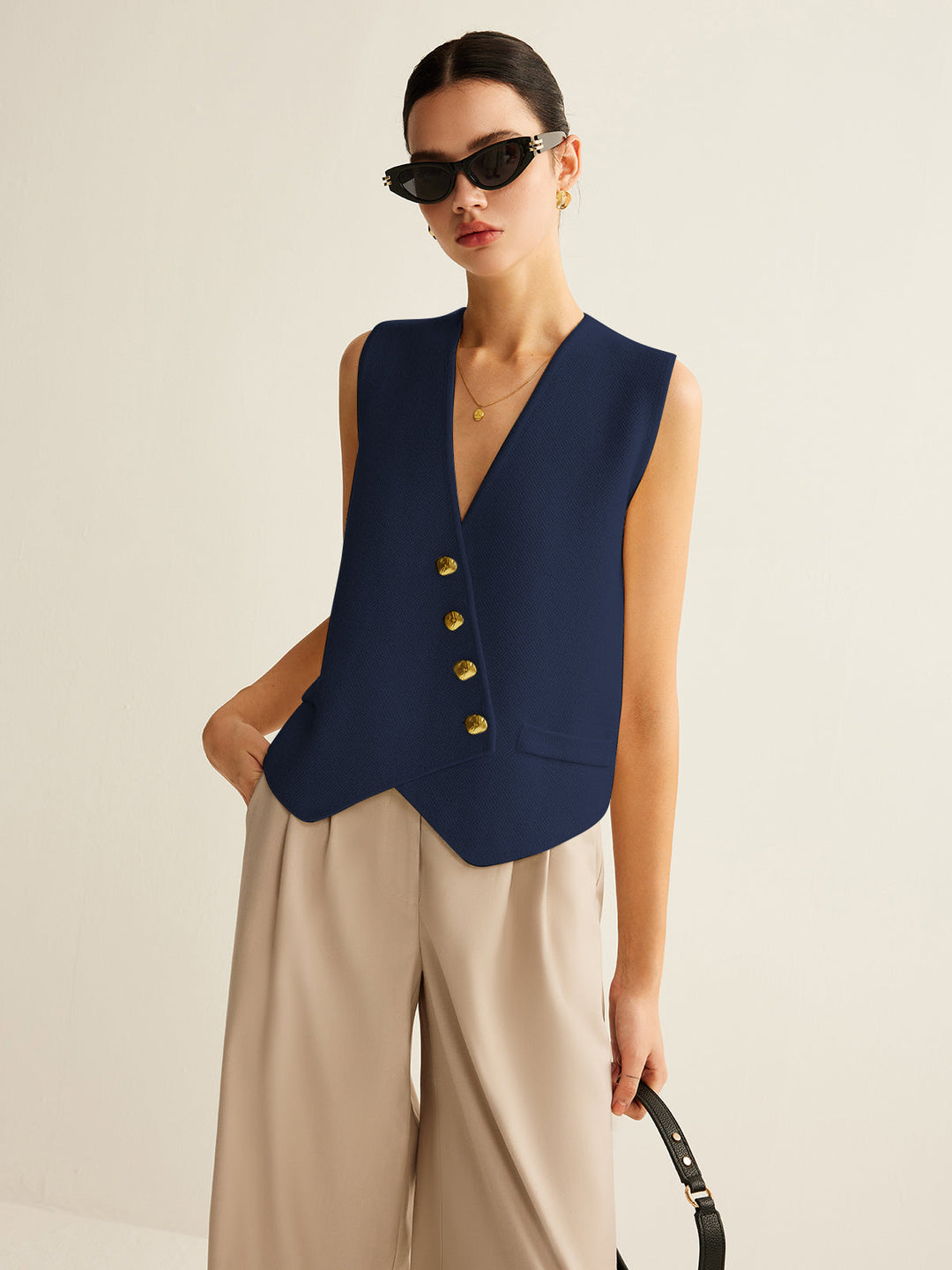 Women's fall fashion sweater vest, a chic sleeveless top to layer over shirts for a stylish look.