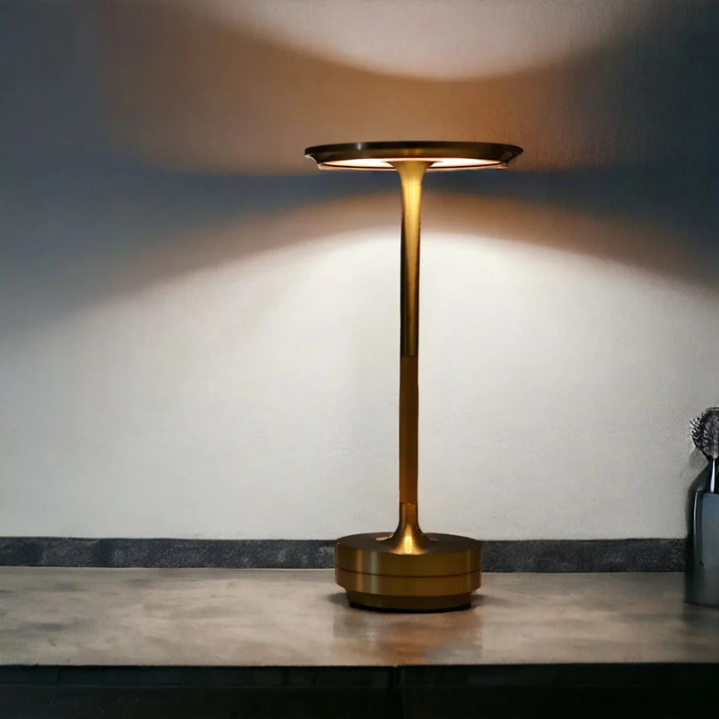 Sleek rechargeable LED table lamp, offering portable ambient light with convenient touch control.
