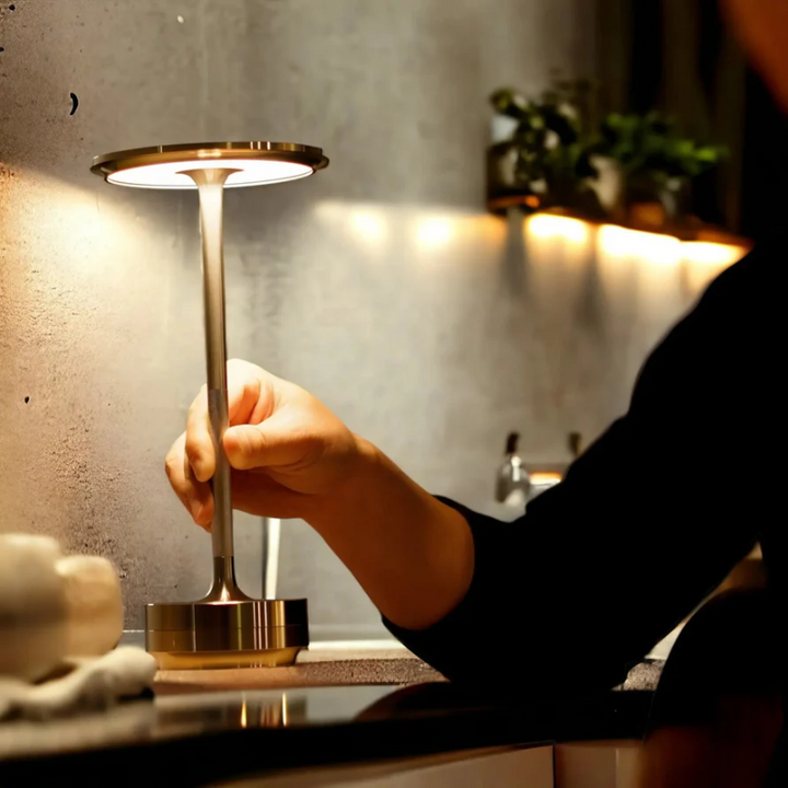 Portable LED table lamp, LumoVibe, with touch control for customizable ambient and accent lighting.