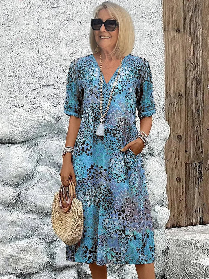 Comfortable women's floral V-neck midi casual dress, ideal for vacation, spring, or summer outings.