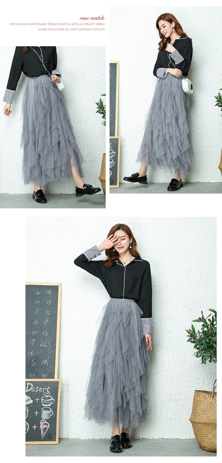 Elegant women's midi skirt with a high waist, beautiful tiers, and a flattering flow.
