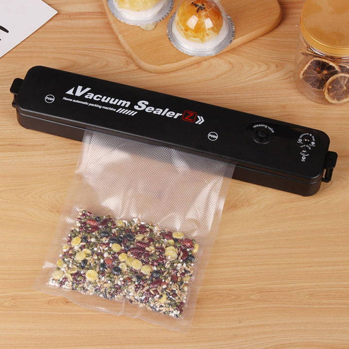 Automatic vacuum sealing machine for fresh food preservation, extending food storage life in any kitchen.
