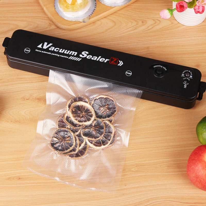 Compact kitchen appliance: automatic food saver vacuum sealer for efficient food preservation & storage.