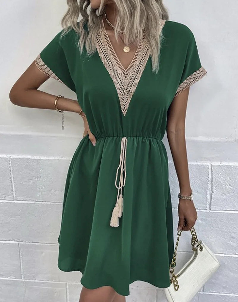 Stylish women's summer V-neck dress, knee-length with unique crochet trim & comfortable drawstring waist for a casual look.