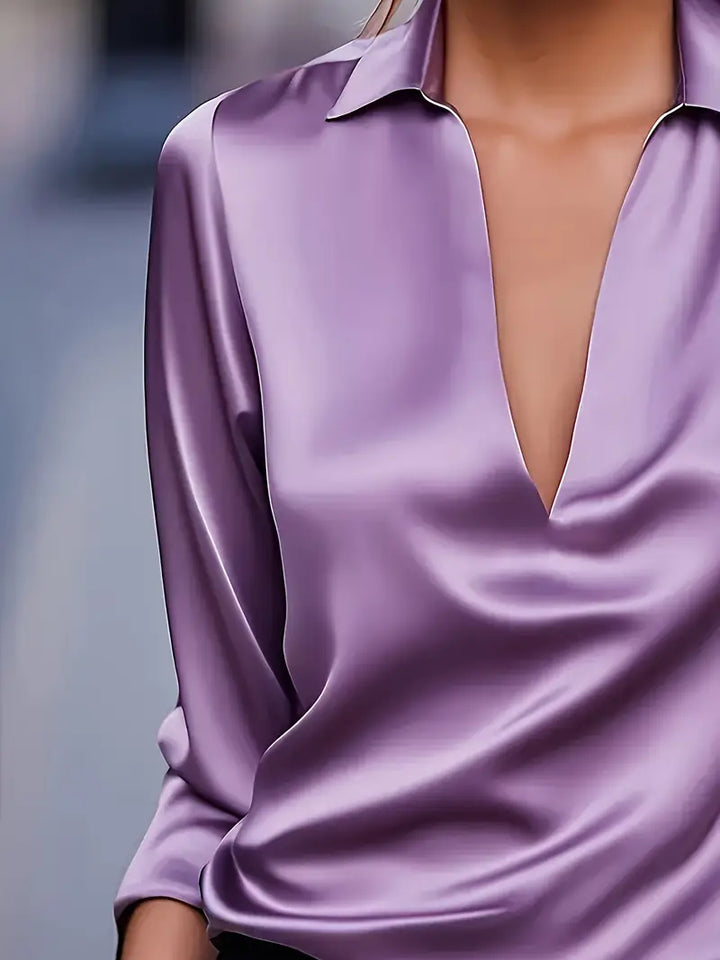 Sophisticated women's V-neck blouse, long sleeve top for office and elegant style.
