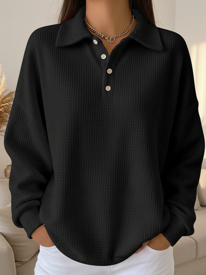 Stylish women's relaxed fit waffle knit polo shirt. Long sleeve, cozy, and comfortable for everyday casual wear.