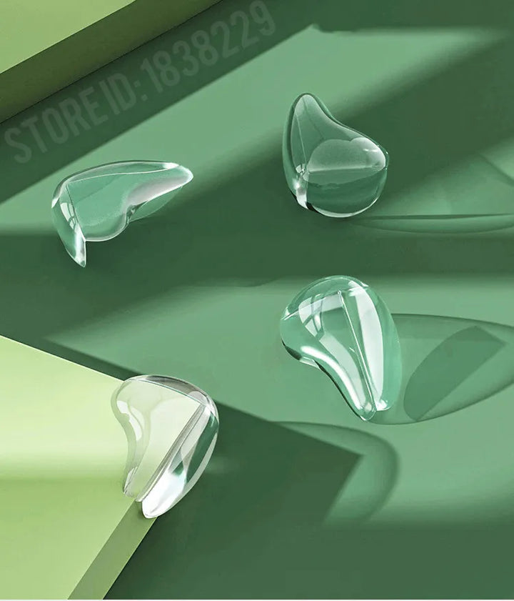 Durable clear silicone corner protectors, 4-pack. Secure furniture guards for infant safety.