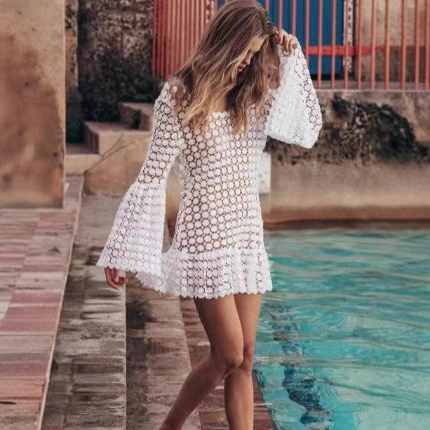 Stylish white backless summer mini dress with chic flared sleeves, a must-have for your beach or vacation.