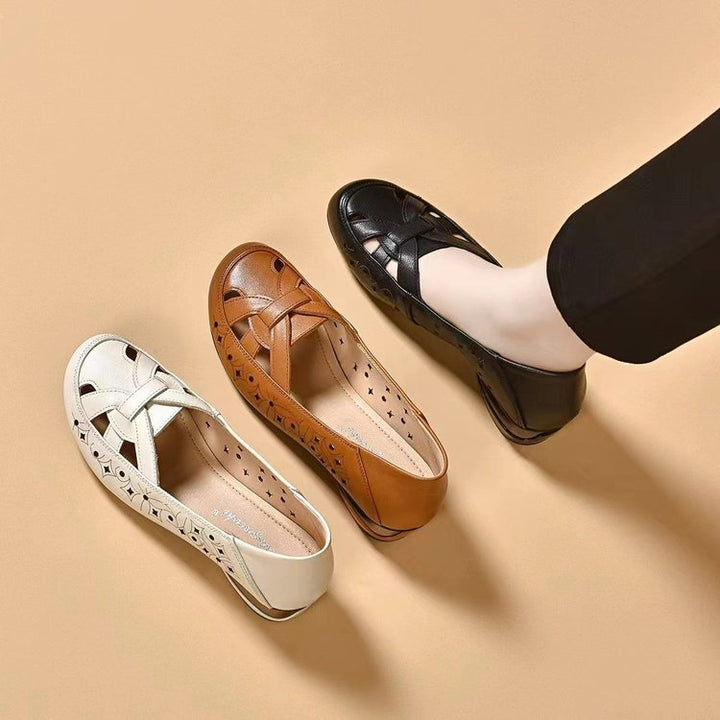 Elegant black women's block heel loafers, easy slip-on design for professional and fashionable footwear.