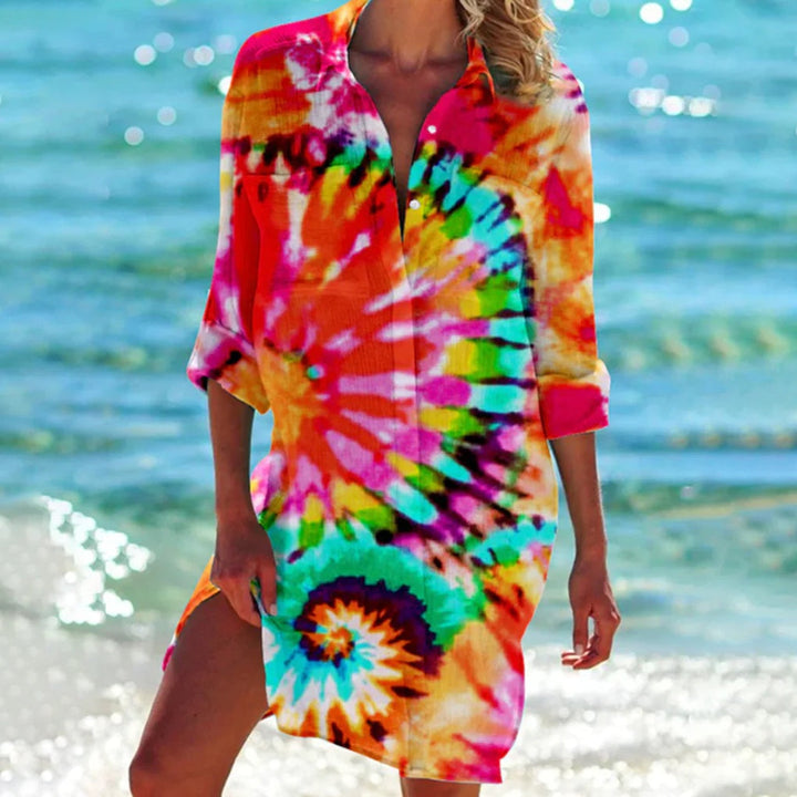 Women's vibrant tie-dye beach shirt, perfect for summer style, with a relaxed, short-sleeve fit.