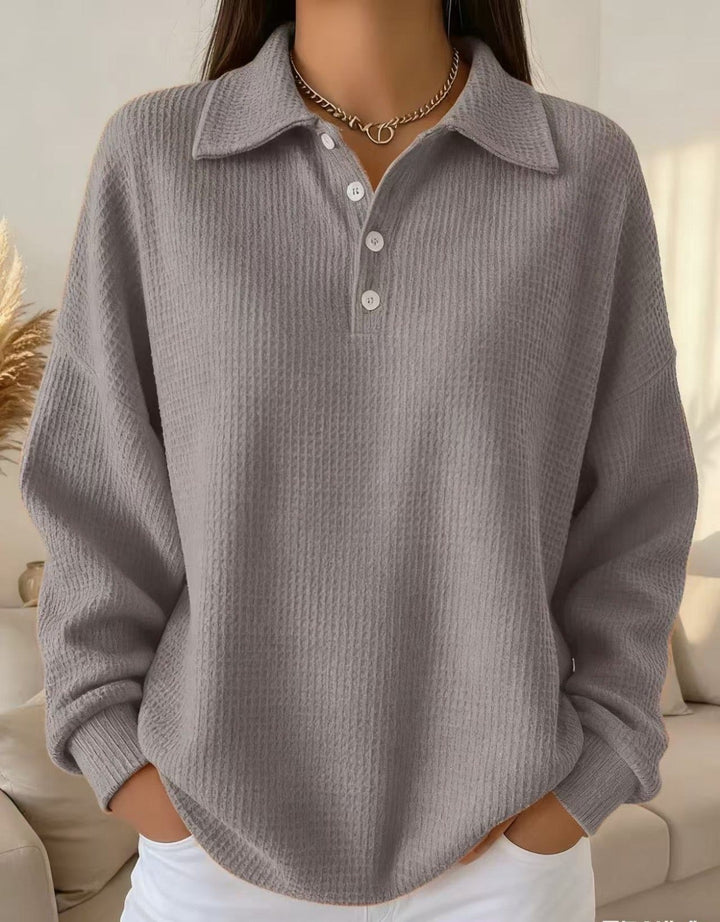 Soft women's long sleeve waffle knit polo shirt with relaxed fit. Textured casual top, ideal for everyday comfort.