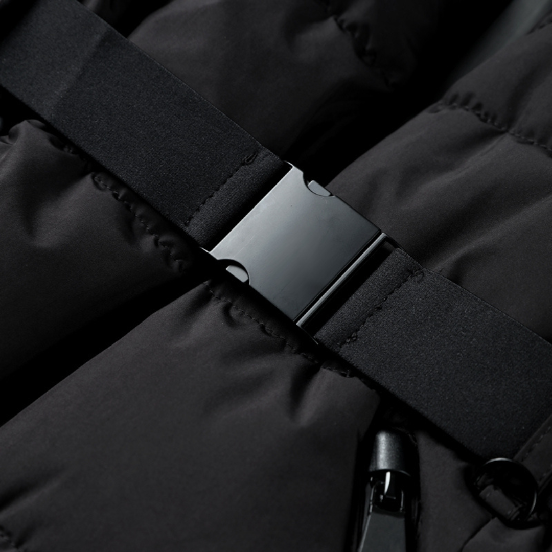 Chic black women's puffer jacket with a belt, offering warmth and a modern winter fashion look.