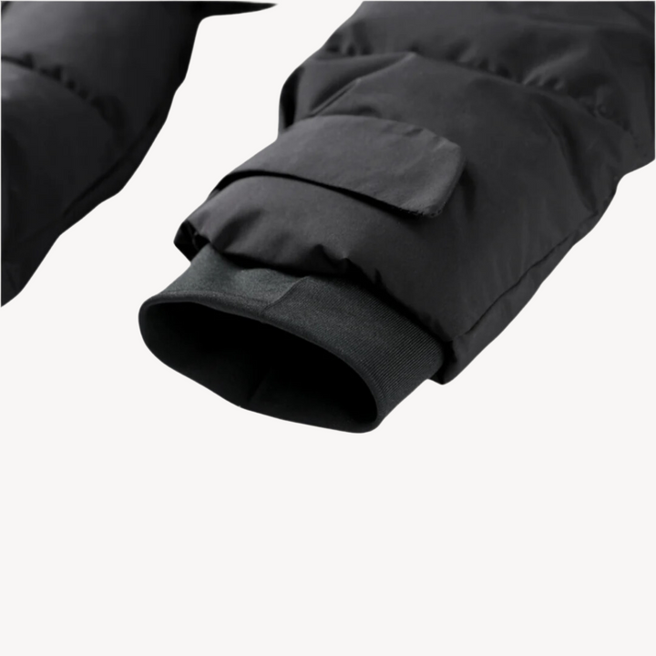 Cozy women's black hooded puffer jacket, cinched with a belt for a chic winter outerwear fit.