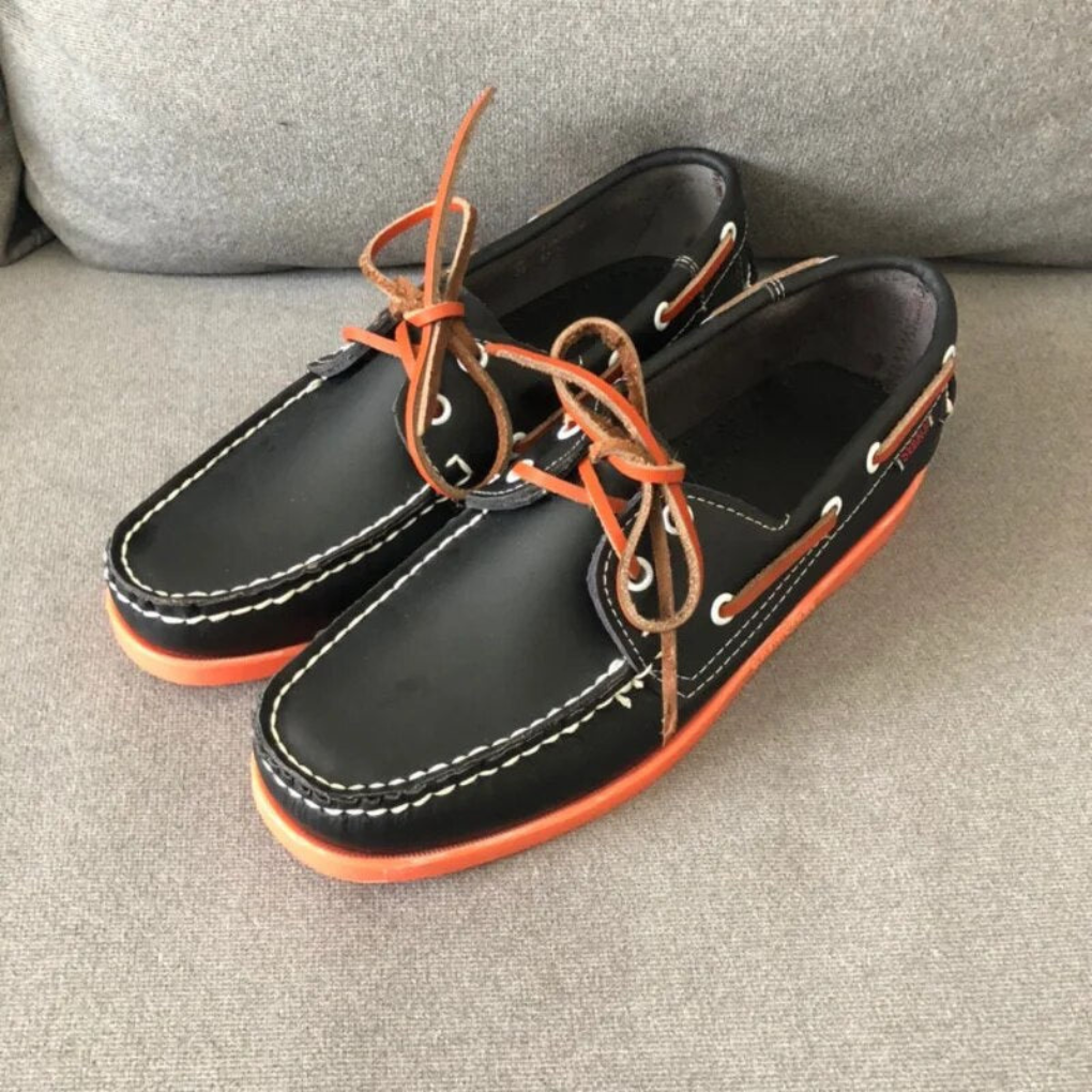 Graceful men's two-tone moccasin boat shoes with lace-up design, ideal for comfortable and stylish everyday footwear.