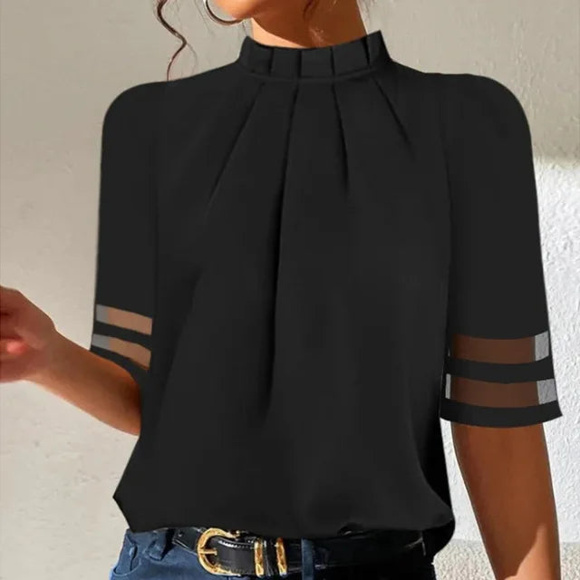 Chic women's black pleated top for modern women. Effortless style, comfort, and elegance for work or casual days.