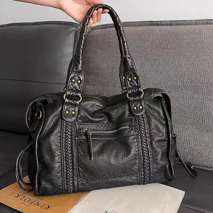 Women's elegant black handbag, perfect for work, school, and daily essentials. Versatile tote and shoulder bag.