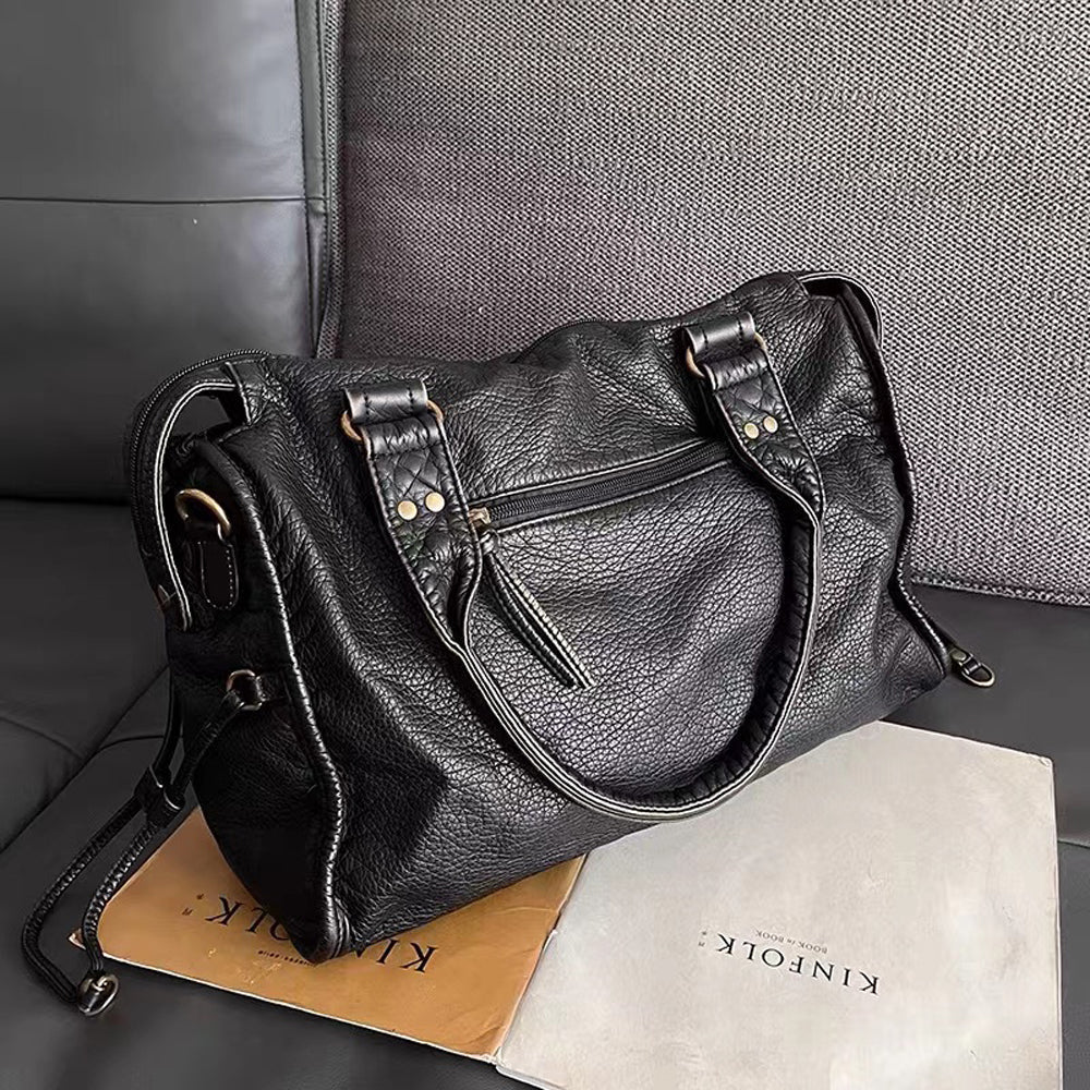 Stylish black women's shoulder bag, also a crossbody. Perfect for school books, work documents, and daily use.