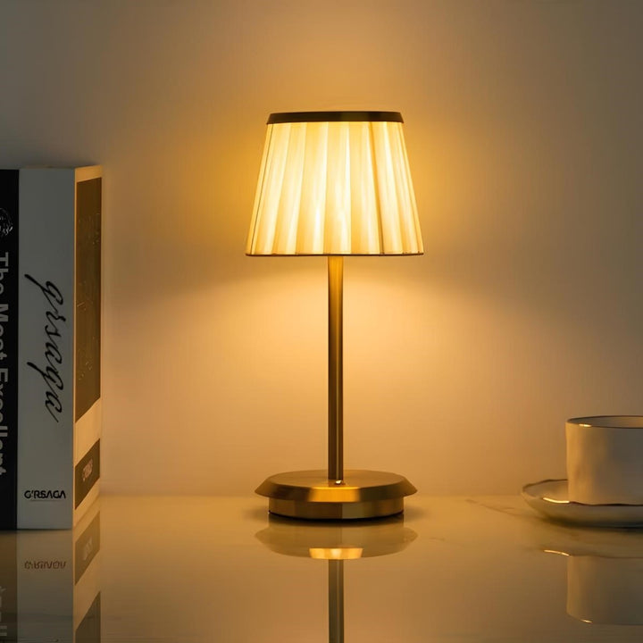 Unisex modern cordless LED table lamp with a soft fabric shade. Rechargeable & dimmable, great for desks or tables.