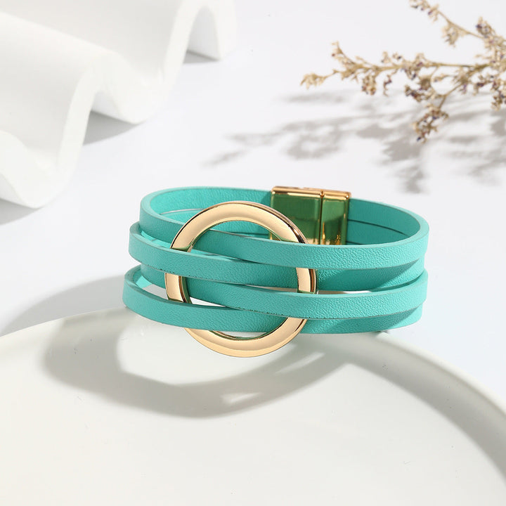 Green bohemian double circle leather bracelet for women. Adjustable, versatile fashion jewelry accessory.