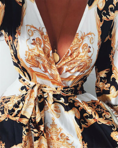 Close-up of the V-neck and wrap detail on a women's boho maxi dress with long sleeves.