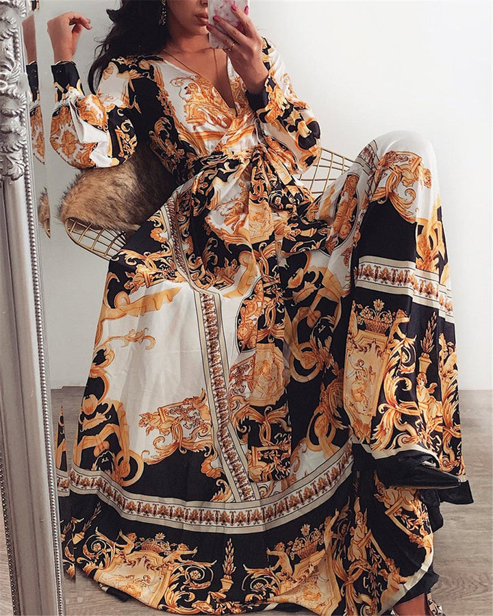Woman modeling a comfortable, flowy boho wrap maxi dress with long sleeves & stylish slit.