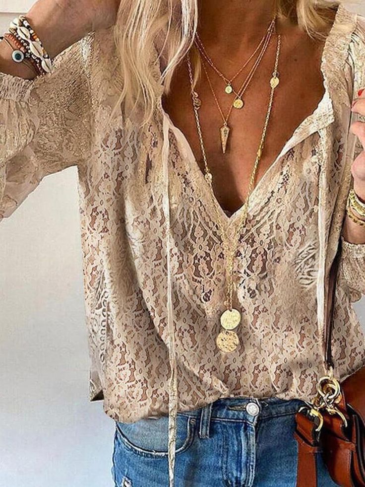 Women's boho lace V-neck relaxed fit blouse top, ideal for summer casual wear. Elegant and flowy feminine clothing.