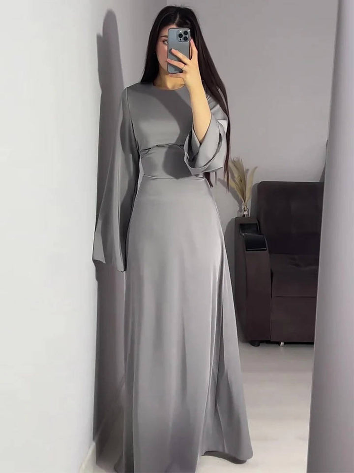 Women's party dress: long maxi with elegant flared sleeves, chic for special events.