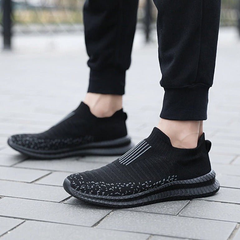 A pair of men's ultra-light breathable slip-on sneakers, great for casual and athletic use.