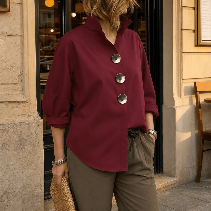 Women's versatile long sleeve button-down blouse, collared, with elegant statement buttons.
