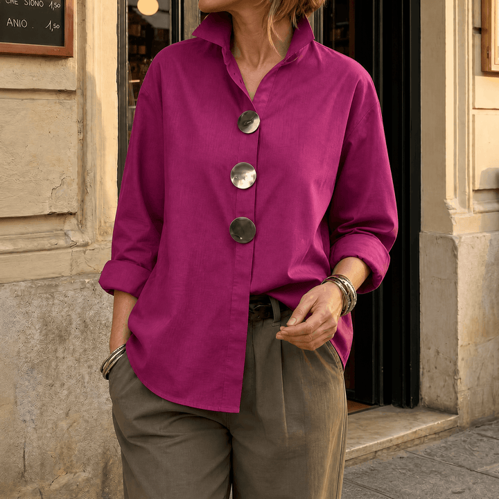 Fashionable oversized women's top, perfect for office or casual, featuring statement buttons.