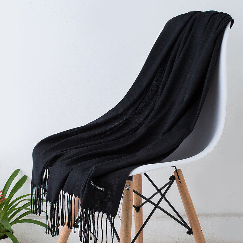 Luxurious Bria cashmere scarf for women. Soft, stylish, and long, perfect for elegant winter fashion.