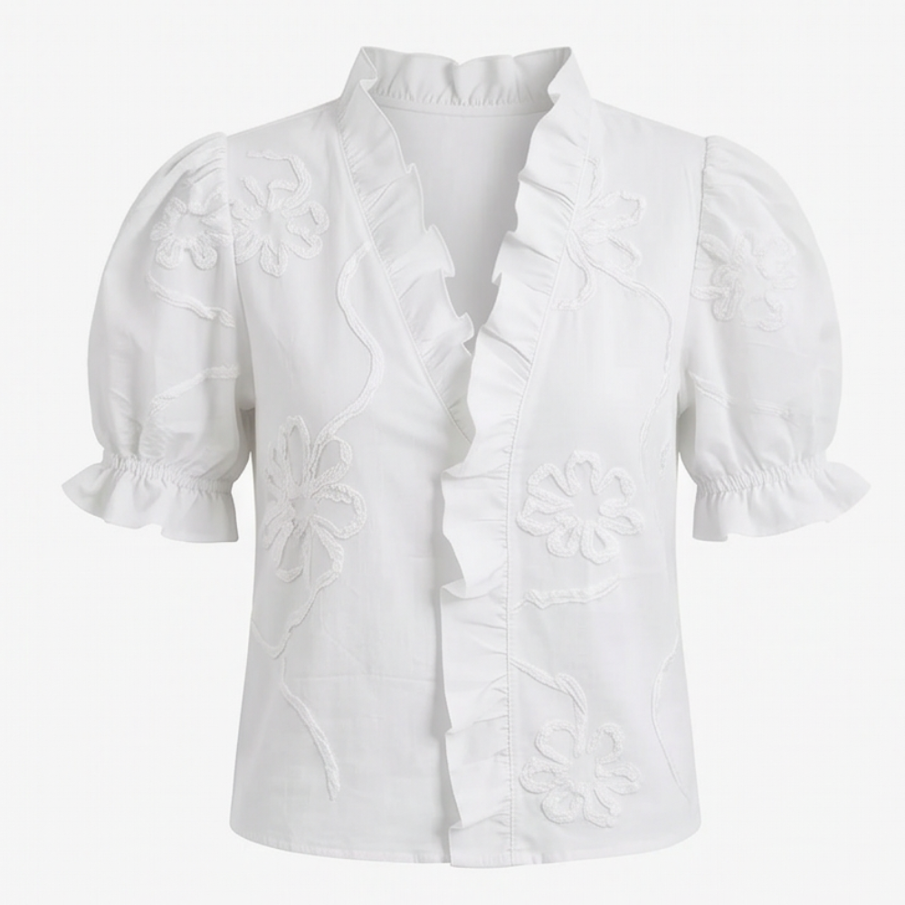 Women's Brinley blouse with exquisite floral embroidery and trendy puff sleeves.