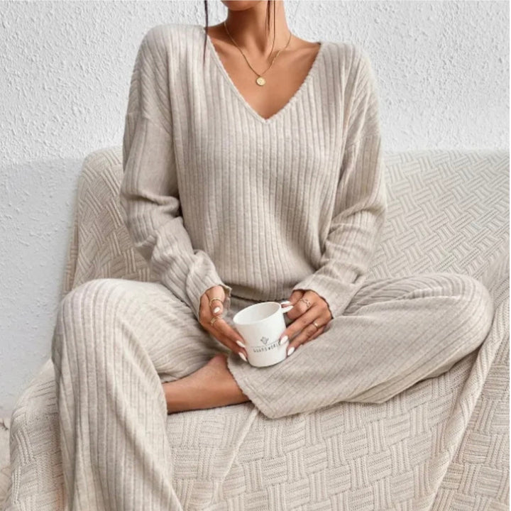 Women's cozy two-piece lounge set, a comfortable sweater and matching pants for relaxed wear.