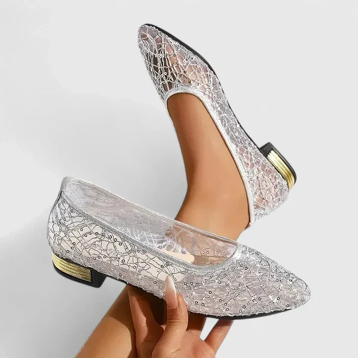 Dressy women's pointed flats with a unique gold heel, adding a touch of glamour to any formal or party outfit.