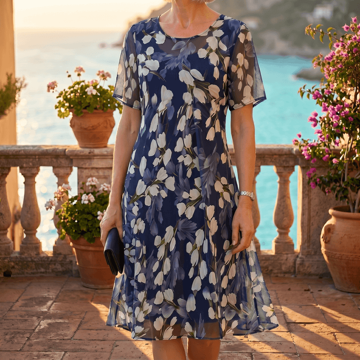 Elegant women's navy floral midi dress, flowy short sleeve, perfect for spring & summer parties.