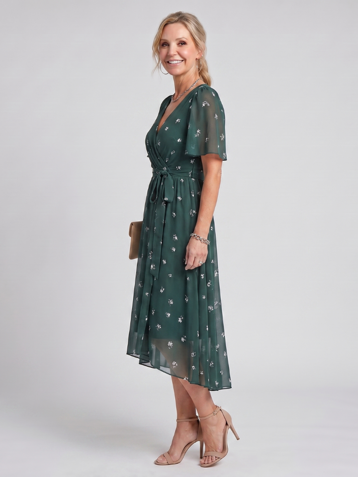 Stylish women's floral print midi dress, a versatile wrap design with charming flutter sleeves.