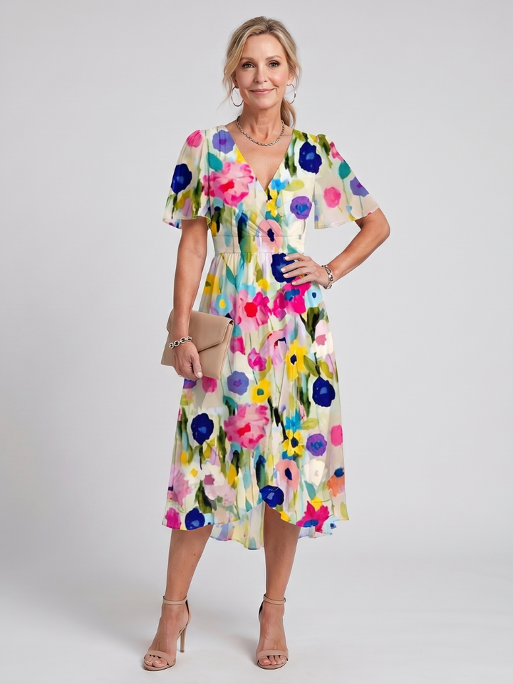 Graceful women's floral print midi wrap dress, designed for comfort and elegance with flutter sleeves.