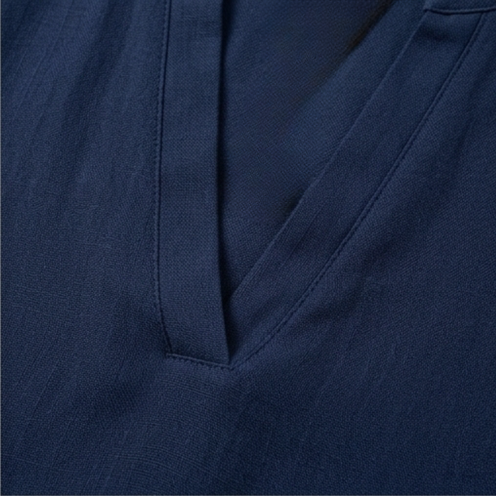 Model wearing a stylish women's V-neck relaxed fit blouse, short sleeve for effortless style.