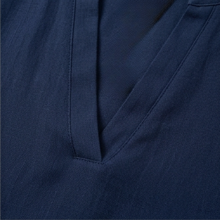 Model wearing a stylish women's V-neck relaxed fit blouse, short sleeve for effortless style.